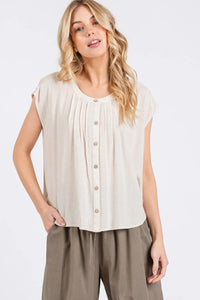 Beige sleeveless blouse with pintuck detailed button front closure and pleated design for elegant wear