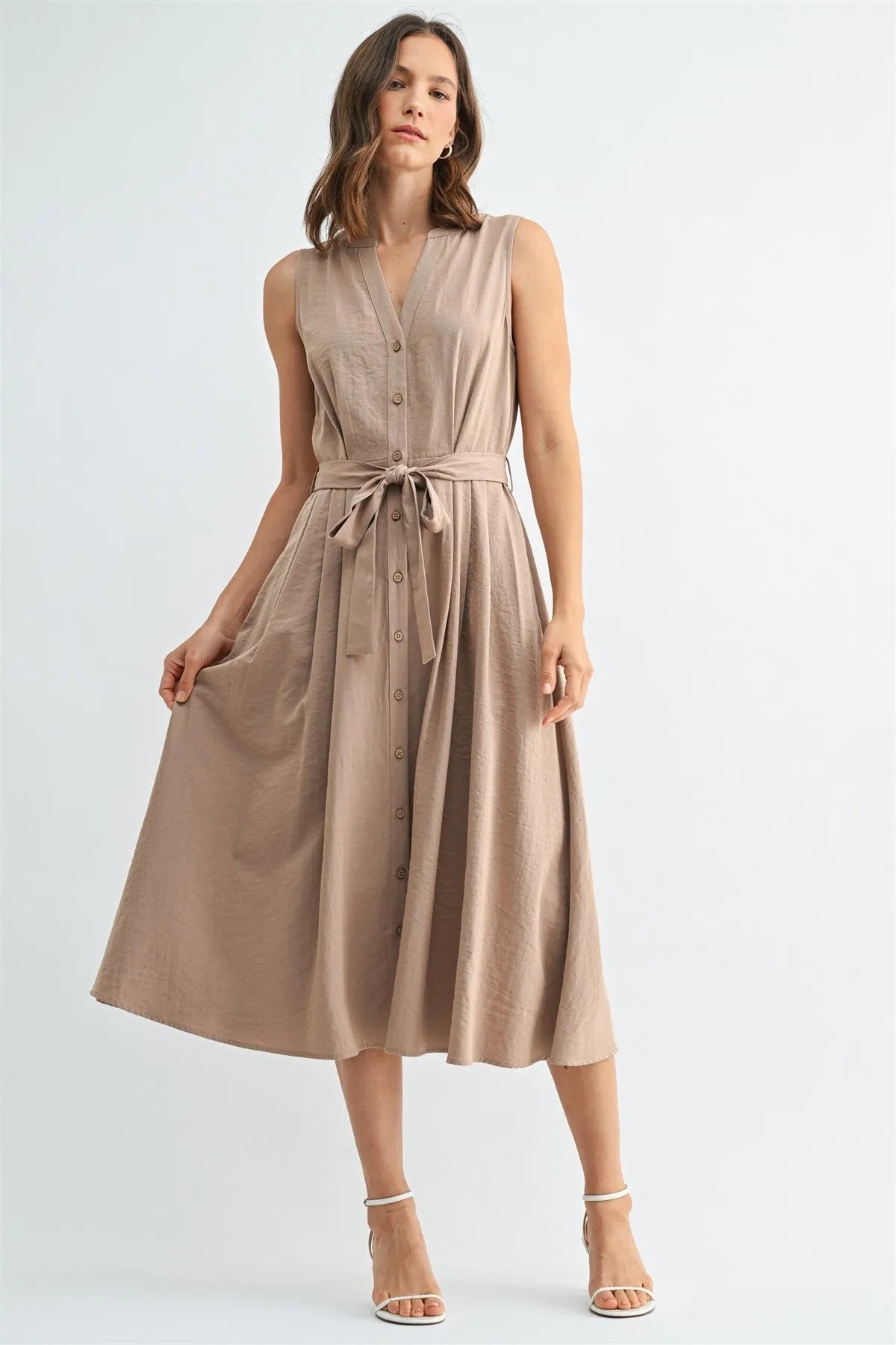 Beige sleeveless v neck button front tie midi dress with a tied waistband in a lightweight fabric for versatile wear