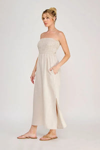 Beige strapless maxi dress with smocked bodice and side slit featuring pockets maxi dress design
