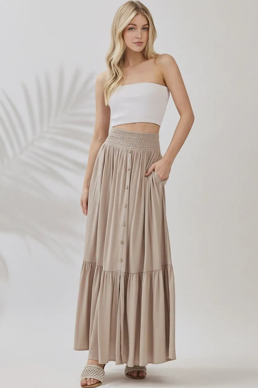 Ruffled smocked waist tiered maxi skirt in beige with button front