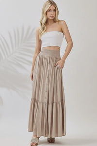 Ruffled smocked waist tiered maxi skirt in beige with button front