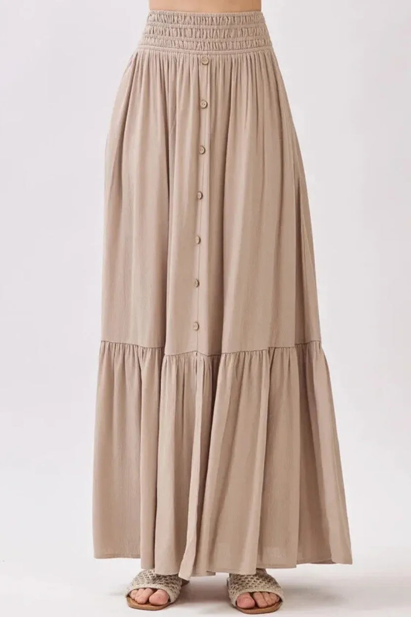 Ruffled smocked waist tiered maxi skirt in beige with button front