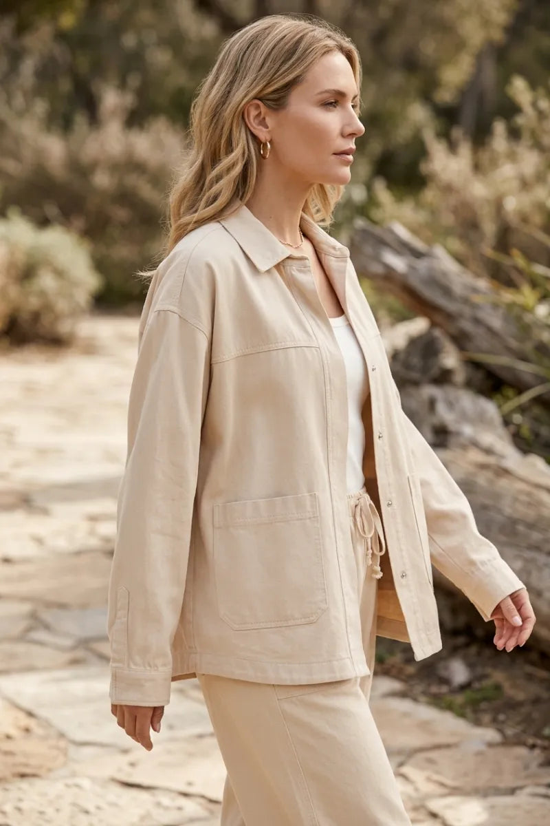 Beige bay breeze twill jacket with button closure and drawstring waist in durable breeze twill fabric