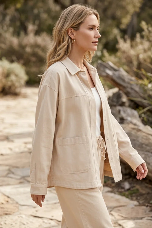 Beige bay breeze twill jacket with button closure and drawstring waist in durable breeze twill fabric