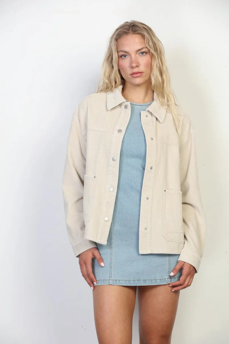 Beige garment washed corduroy chore jacket with button closures and front pockets in washed corduroy chore style