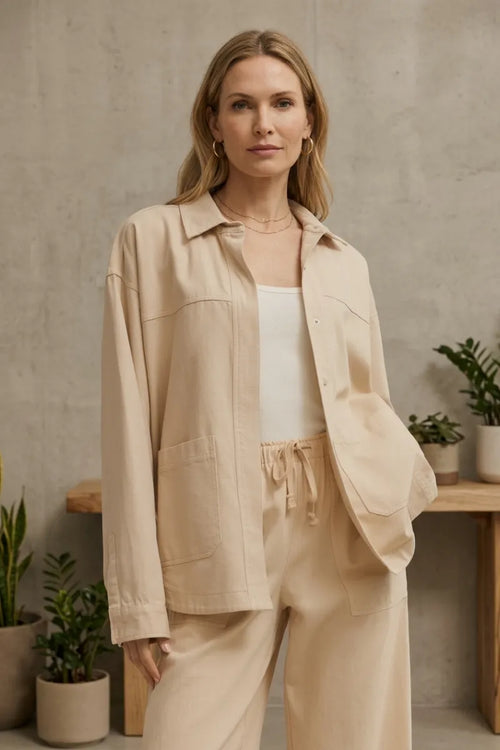 Beige bay breeze twill jacket with utility-style button-up front pockets and a relaxed fit design