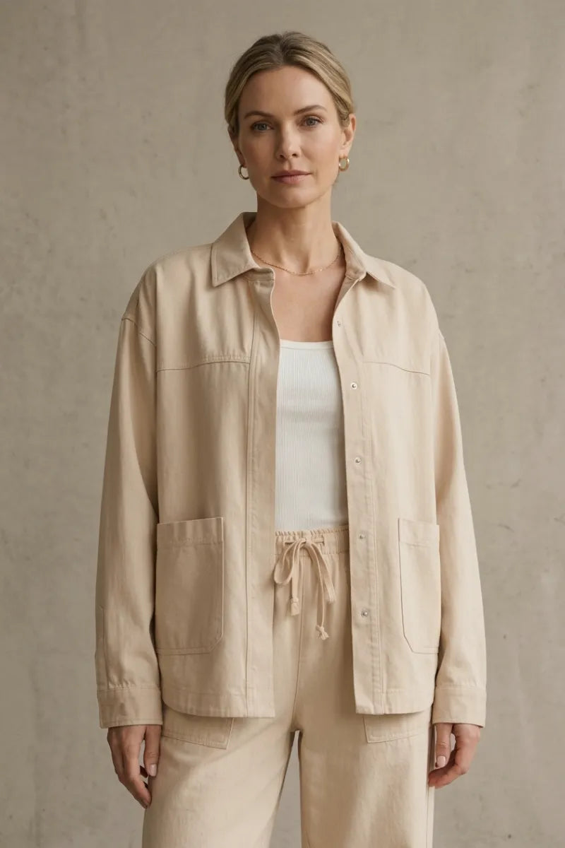 Beige bay breeze twill jacket with button-front closure, two large patch pockets, and a collar in utility style