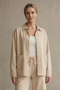 Beige bay breeze twill jacket with button-front closure, two large patch pockets, and a collar in utility style