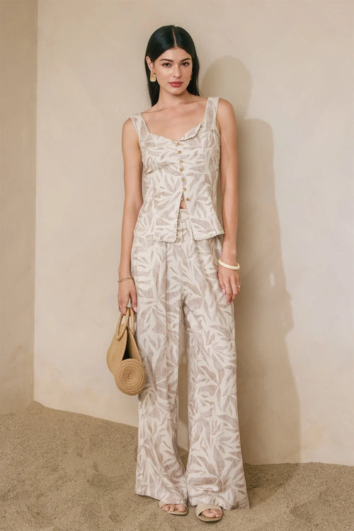 Beige white leaf-patterned sleeveless pleated wide leg jumpsuit front