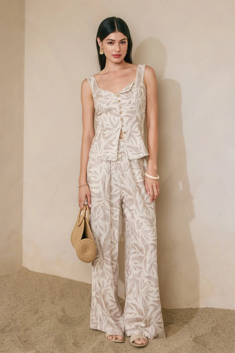Beige white leaf-patterned sleeveless pleated wide leg jumpsuit front