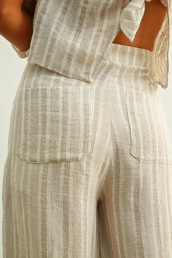Beige and white vertically striped jacquard linen pockets pants with a relaxed fit for women’s boho chic clothing