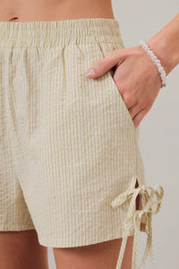 Beige and white vertically striped cotton ties stripe short with a side drawstring tie for adjustable fit