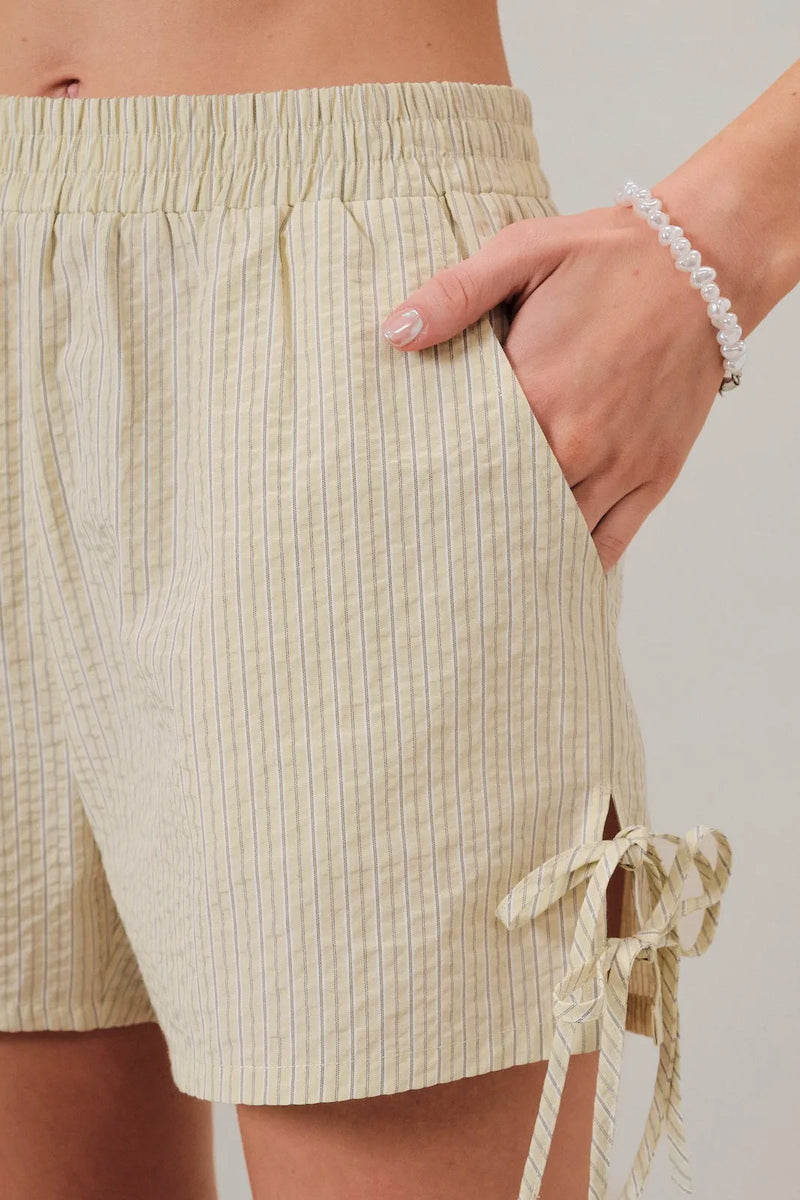 Beige and white vertically striped cotton ties stripe short with a side drawstring tie for adjustable fit