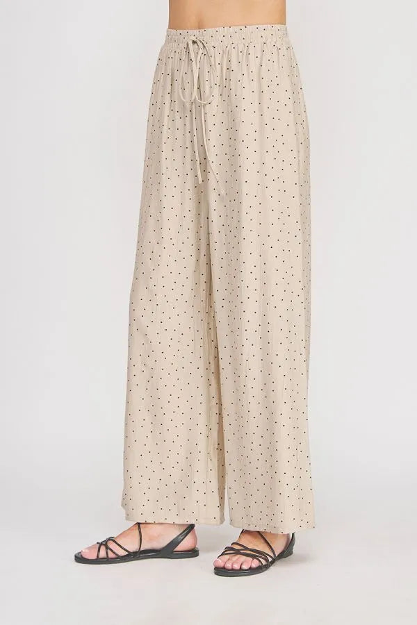 Beige wide leg pant with dots textured wide pattern and elastic waistband with matching drawstring