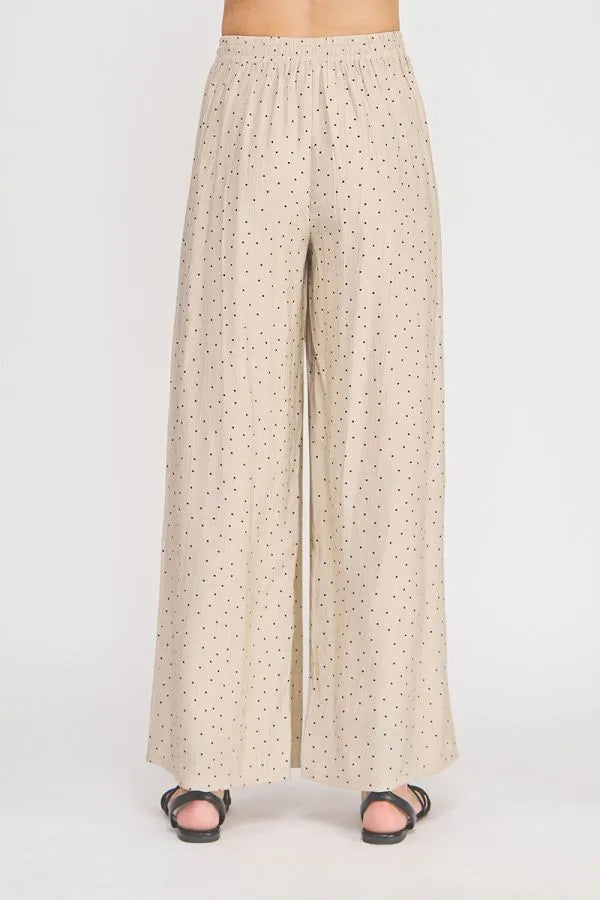 Beige polka dots textured wide leg pant with elastic waistband offering comfortable wide leg fit