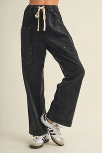 Black corduroy drawstring waist wide leg utility pants with multiple cargo pockets for versatile wear