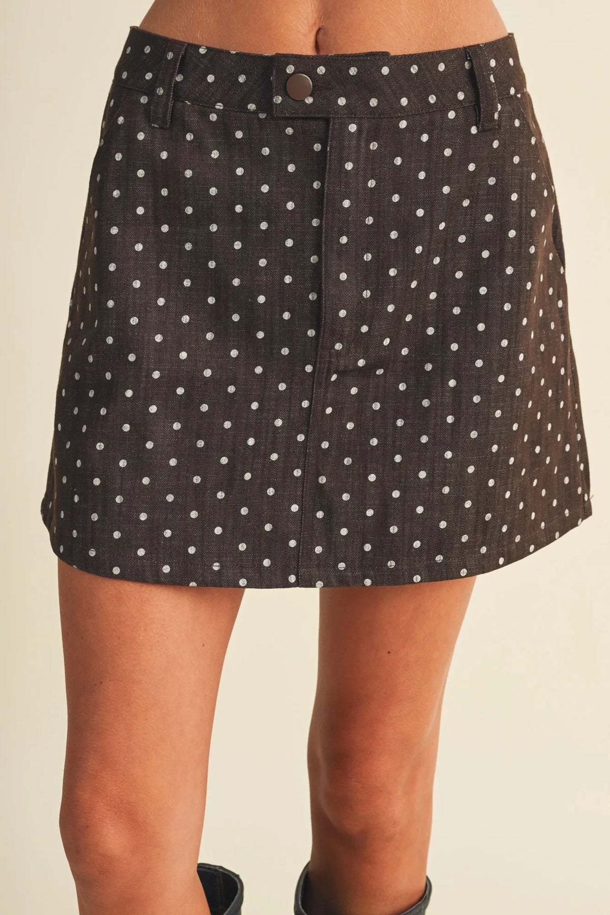 Black denim polka dot utility skort mini skirt with white dots and button closure for casual wear
