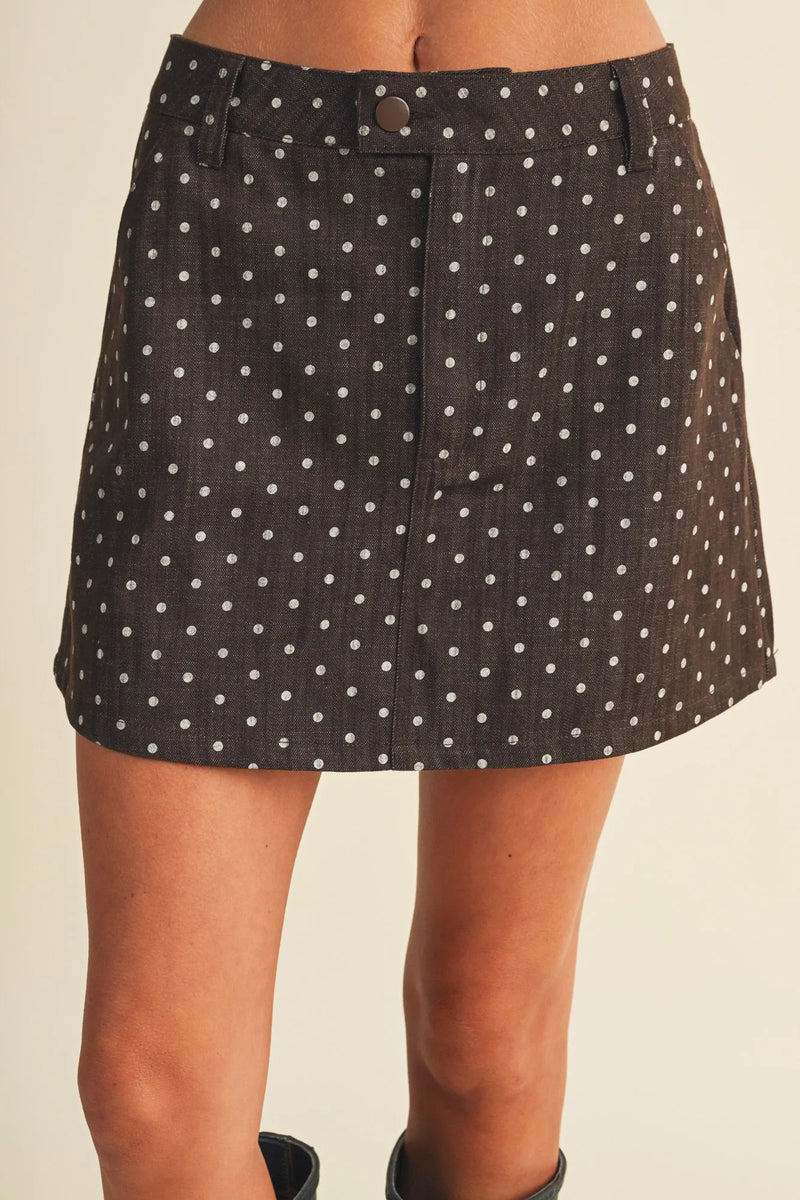 Black denim polka dot utility skort mini skirt with white dots and button closure for casual wear