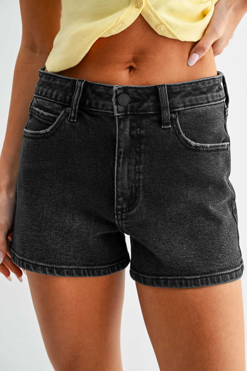 High rise classic hem denim shorts in black with distressed finish