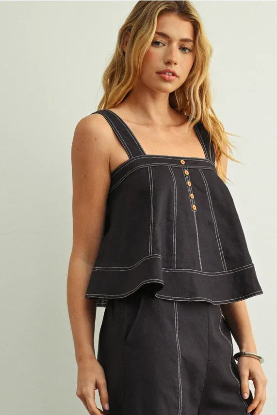 Black denim stitch detailed sleeveless top with white stitching and gold-tone buttons for stylish wear