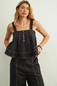 Black denim stitch detailed sleeveless top with white stitching and wooden buttons for stylish casual wear