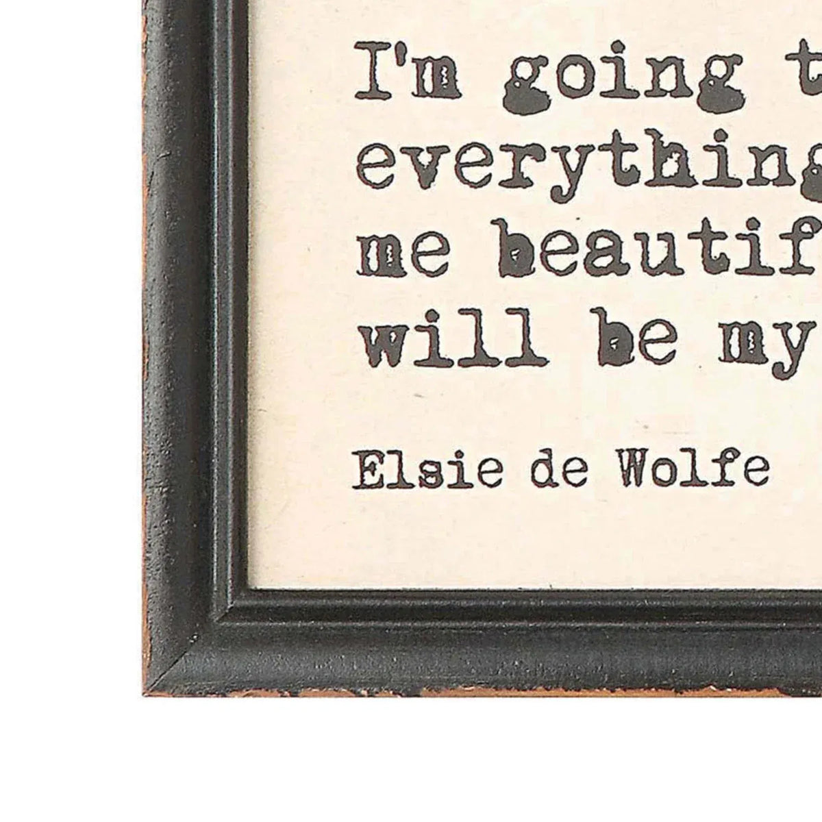 Wood framed wall decor featuring black distressed wood and typewriter-style lettering on a cream background