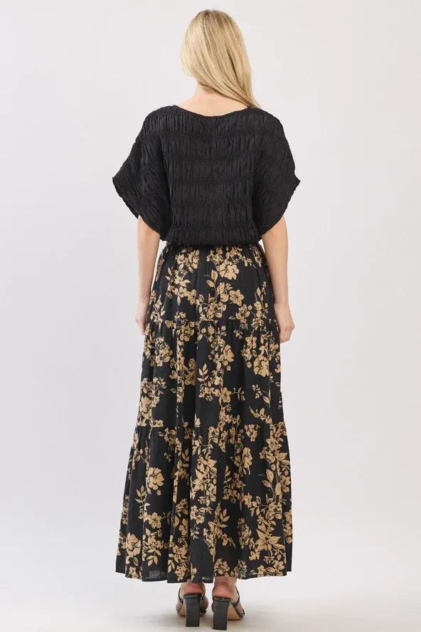 Black floral drawstring tiered midi skirt with gold botanical print and tiered hem perfect for casual wear