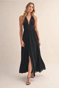 Black halter neck crinkle linen maxi dress with deep v cut neckline and flowing chiffon fabric