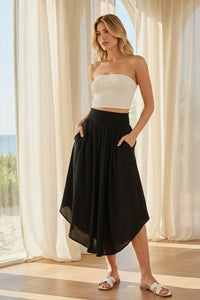 Black flowy smocked waistband midi skirt, high-waisted asymmetrical with slits