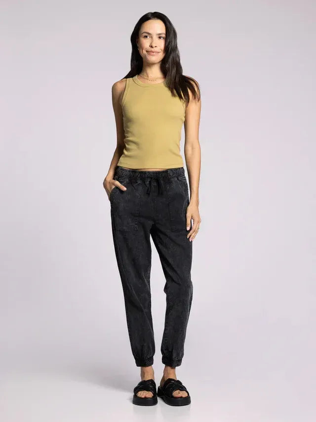 Black drawstring jogger pants with relaxed fit and cuffed ankles paired with evie basic tank top