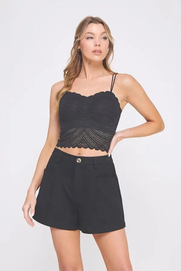 Black lace crop top bralette with fine lace pattern and scalloped edges featuring thin spaghetti straps