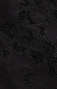 Black lace fabric with intricate floral patterns and delicate mesh detailing on midnight embroidered short sleeve top