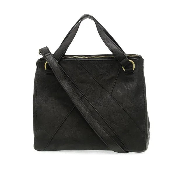 Black leather janet puzzle convertible crossbody tote with gold-tone hardware and diagonal stitching details