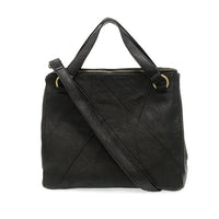 Black leather janet puzzle convertible crossbody tote with gold-tone hardware and diagonal stitching details
