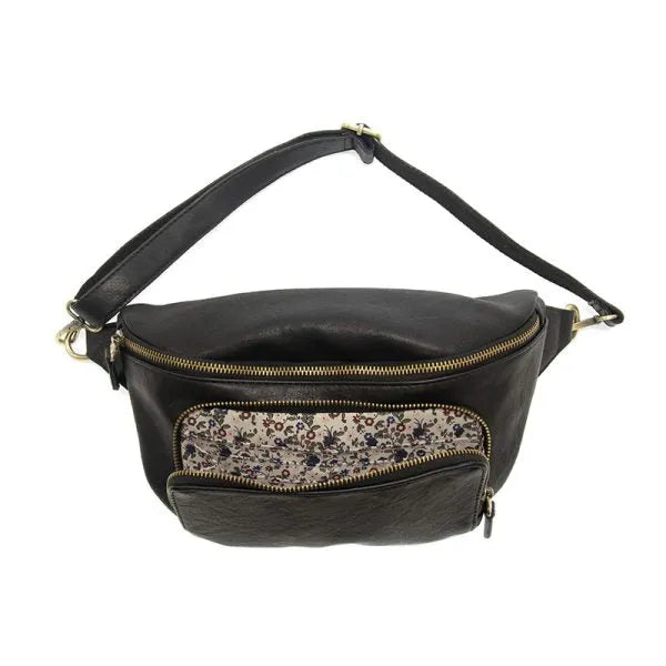 Black leather rory organizer sling belt bag with gold-toned zippers and floral-patterned interior lining