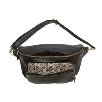 Black leather rory organizer sling belt bag with gold-toned zippers and floral-patterned interior lining