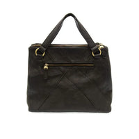 Black leather janet puzzle convertible crossbody tote with gold-tone zippers and handles for versatile use