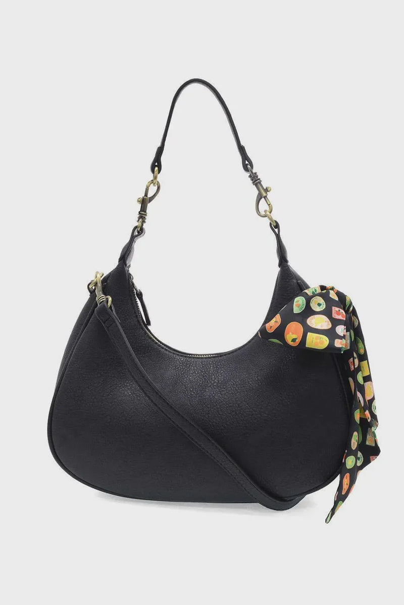 Black leather hobo bag with colorful farmers market scarf tied to the side market scarf convertible crossbody