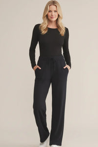 Black Second Skin Crew long sleeve jumpsuit with drawstring waist and pockets