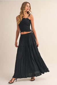 Black crinkled elastic maxi skirt with high waist and ruffled layers