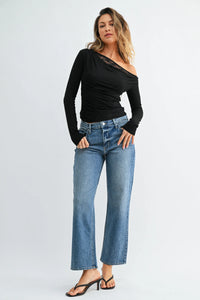 Black one-shoulder long-sleeve top with lace trim paired with mid rise classic straight leg jeans denim