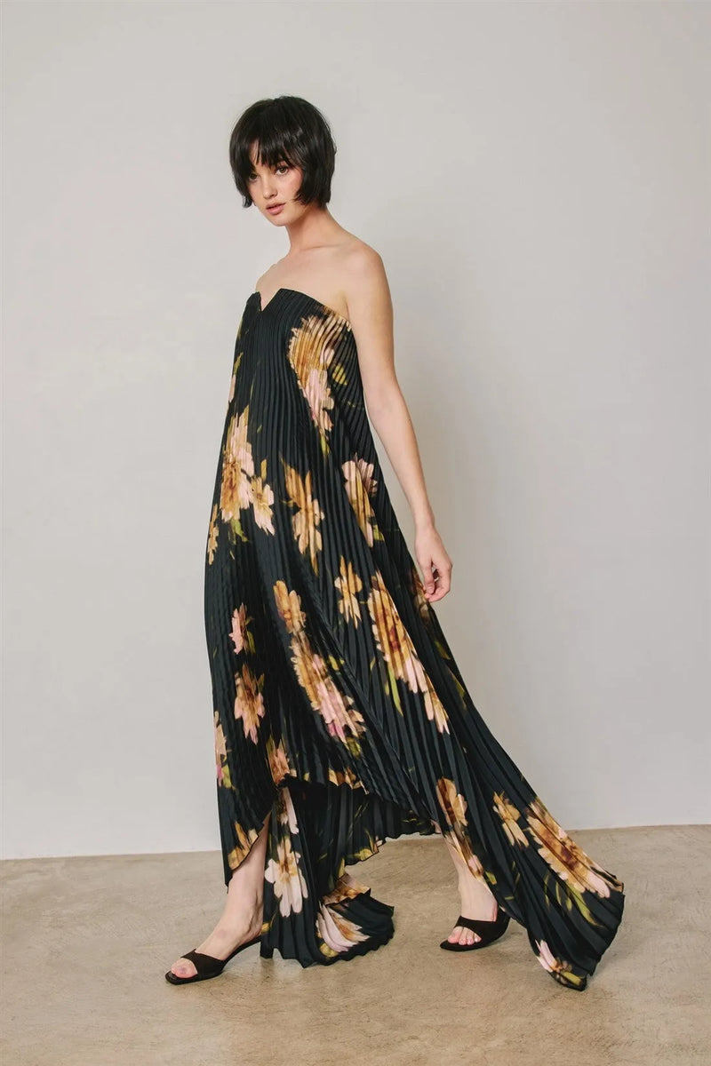 Black floral strapless pleated maxi column dress with gold and peach floral pattern in lightweight fabric
