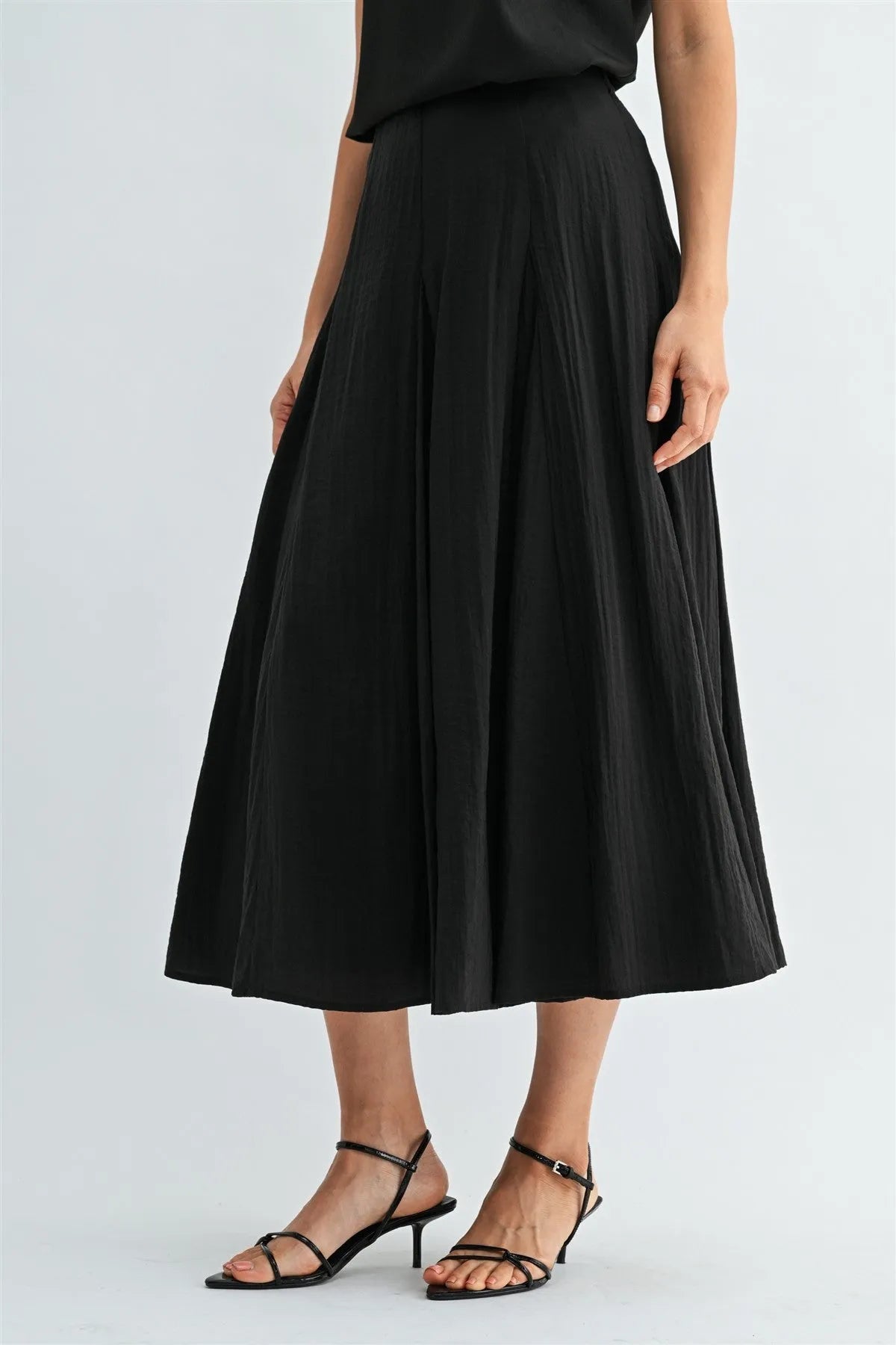 Black godet midi skirt with pleated flowing a-line silhouette and side zipper for elegant wear