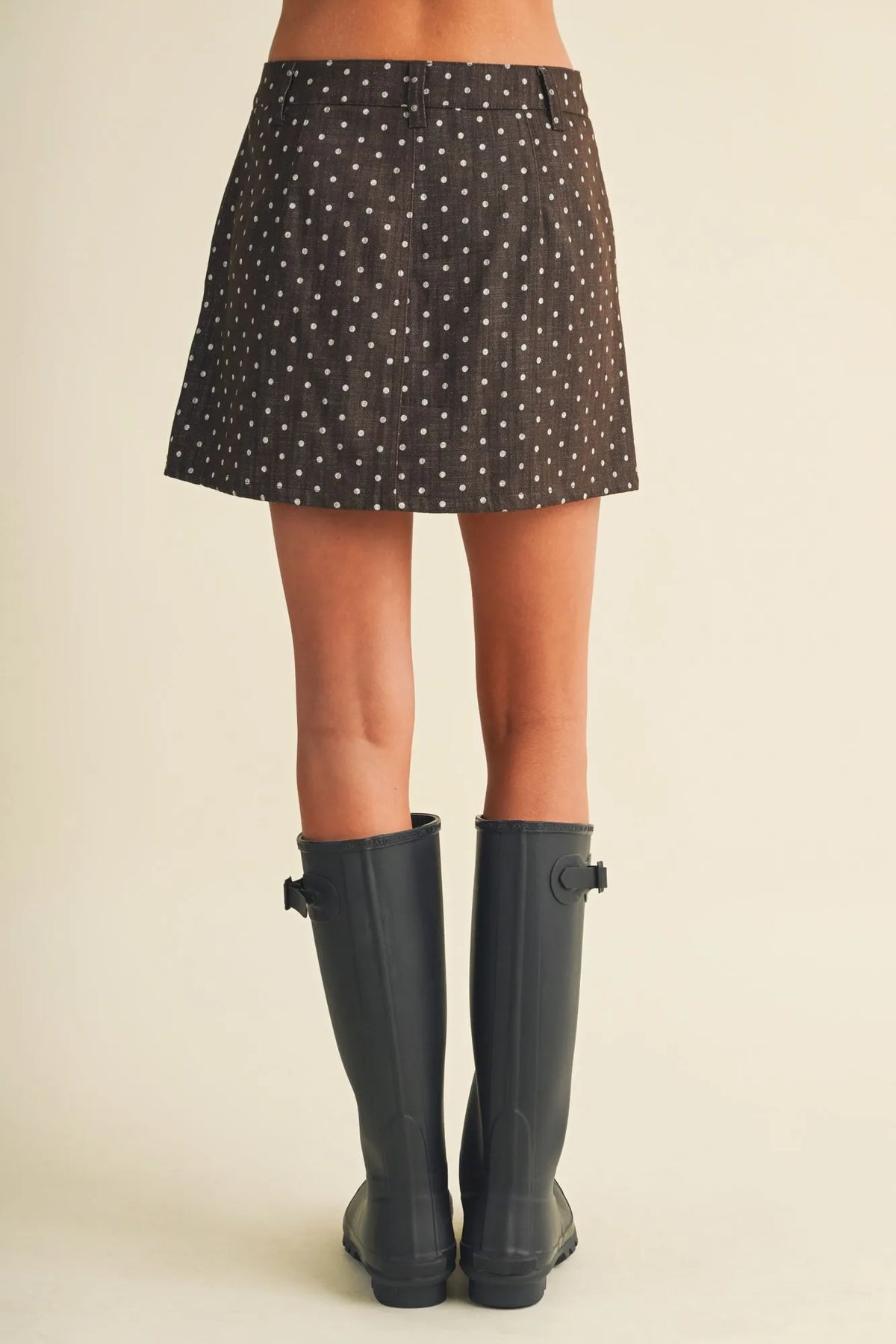Black polka dot utility skort featuring white dots a-line design and a comfortable waistband for versatile wear