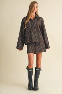 Black polka dot utility skort two-piece outfit with button-up shirt and matching skirt in lightweight fabric
