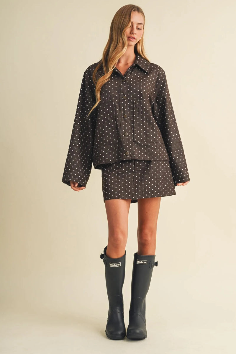 Black polka dot utility skort two-piece outfit with button-up shirt and matching skirt in lightweight fabric