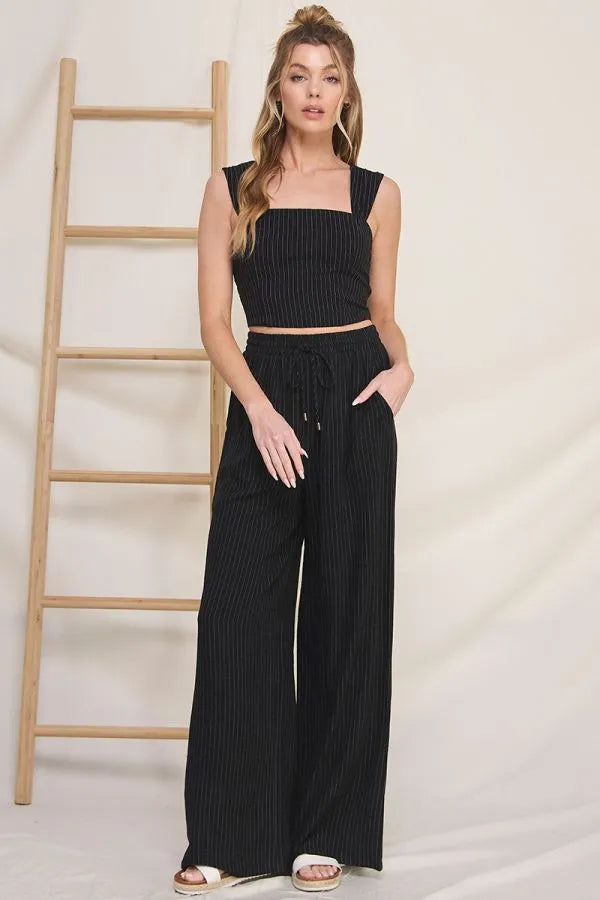 Black ribbed crop top with square neckline paired with striped linen smock wide-leg pants with drawstring waist