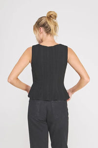 Black ribbed knit sleeveless top with peplum hem featuring a square neck zig zag design in a zag blouse style