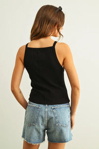 Black ribbed tank top with thin straps in women’s boho chic clothing. Shop Daisy
