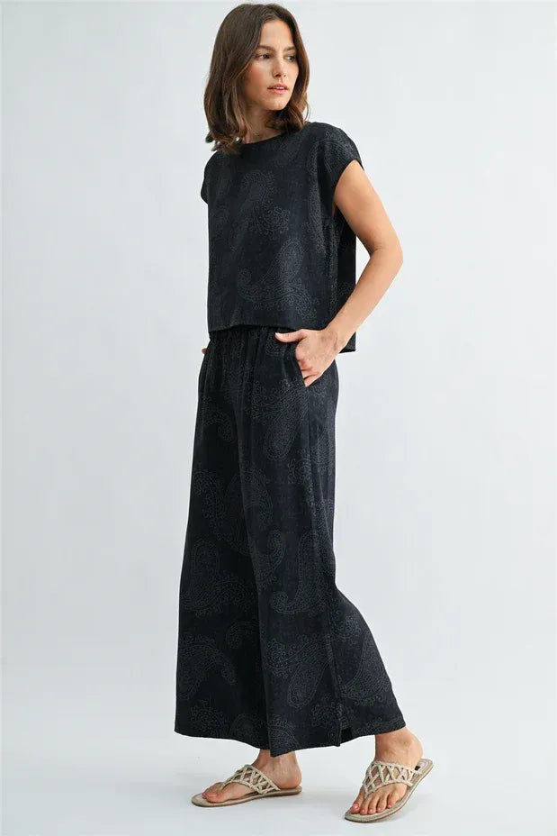 Black satin paisley printed elastic waist pants with matching top featuring a subtle paisley printed elastic design